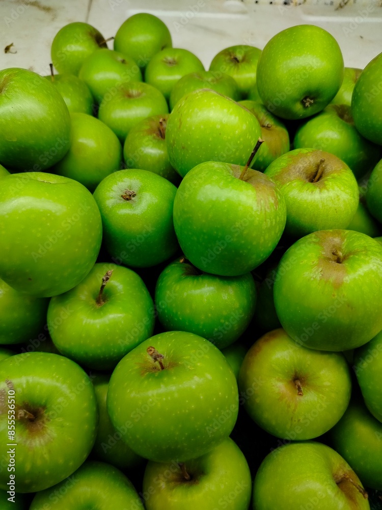 Photo of natural organic ripe sweet green apples. Sweet, fresh and healthy fruit. Photo of natural organic ripe sweet green apples. Sweet, fresh and healthy fruit.