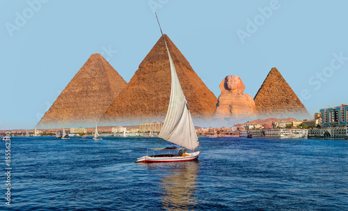 Beautiful Nile scenery with traditional Felluca sailing boat in the Nile on the way to Giza pyramids and The great Sphinx  - Cairo, Egypt   photo