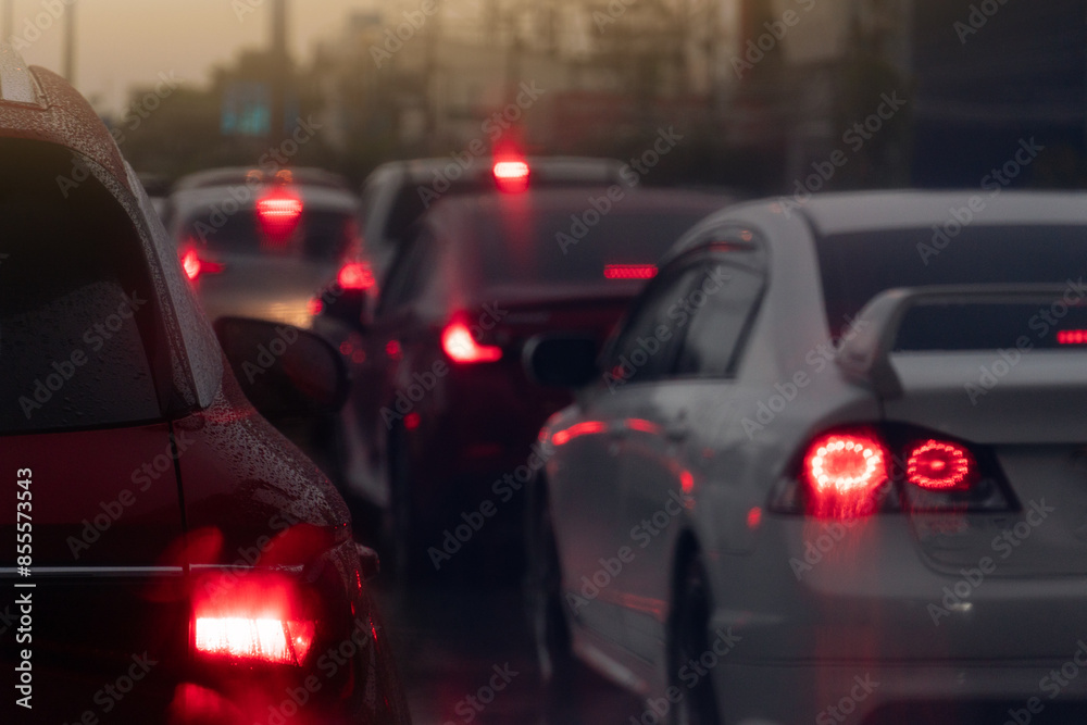 Abstract and blurred of rear side car on the road. Car turn brake light. Traffic jam in the city. On body of cars with water drop of rain. Rainy time in the city. Abstract and blurred of rear side car on the road. Car turn brake light. Traffic jam in the city. On body of cars with water drop of rain. Rainy time in the city.