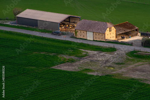 Sussex flint barn in farm yard at dawn