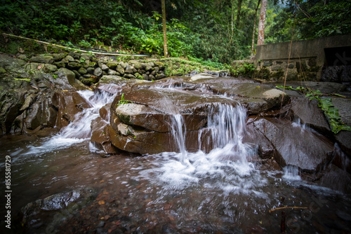 Small river in the salak mountain forest area of ​​Bogor, West Java, Indonesia. Long exposure photo.