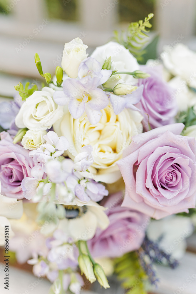 Fototapeta premium Bouquet featuring lavender and white roses with delicate greenery