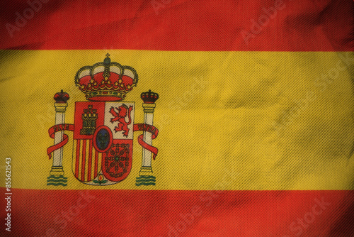 Spain nation flag on crumpled fabric background , country flag