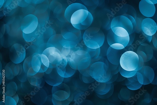 Abstract blue bokeh background featuring defocused circular light patterns, perfect for creative design projects and artistic visuals.