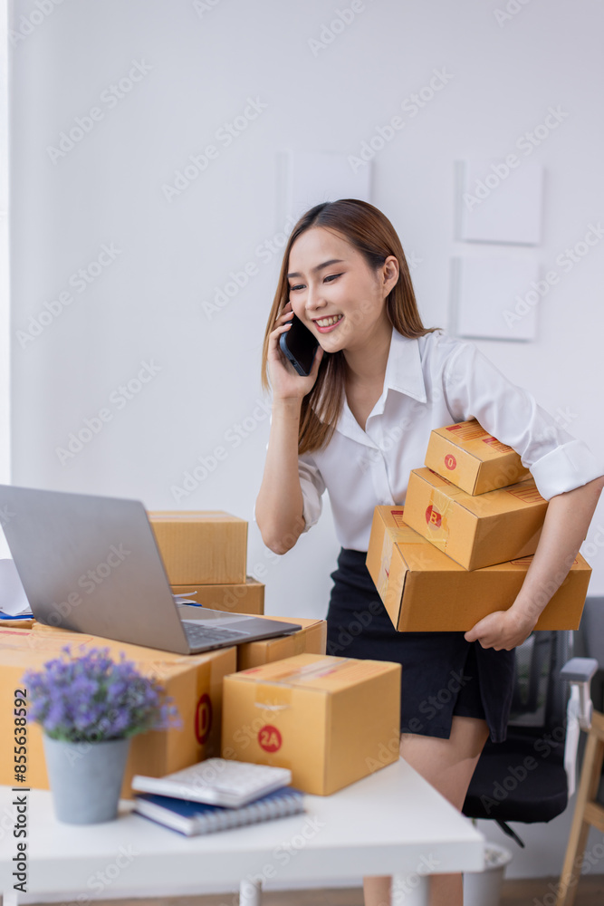 Pretty Asian sme business woman working Custom Ecommerce Packaging leading supplier of custom packaging. create a personalised experience, fast production SME and competitive pricing
