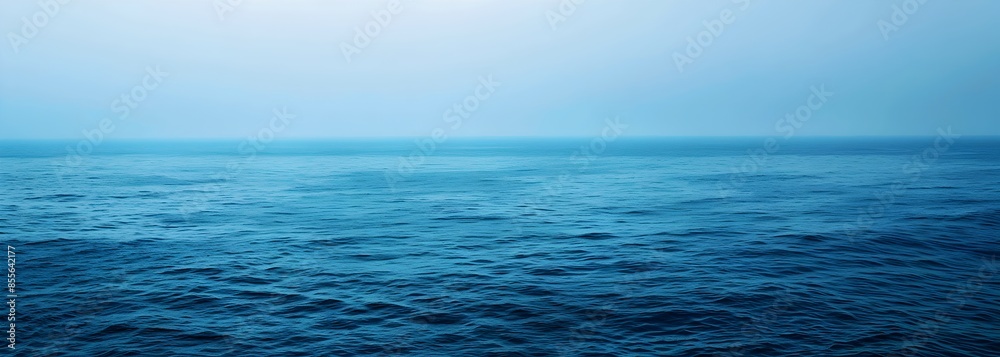 Obraz premium A wide shot of an ocean blue background, with the bottom edge slightly blurred