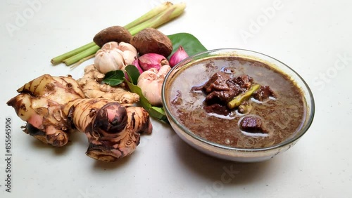 Rawon is a typical Indonesian dish originating from Ponorogo, East Java, which is a black meat soup with a mixture of special spices using kluwek photo