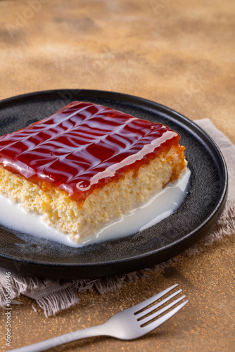 Caramel trilece dessert on stone background. Traditional Turkish cuisine flavor. close up photo