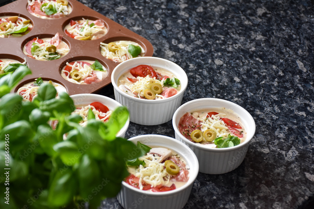 Pizza muffins with basil, olives, tomatoes Pizza muffins with basil, olives, tomatoes
