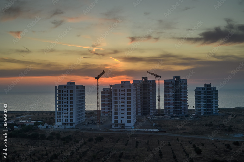 The glow of the sunset sky, the crane of a large rental building 2 The glow of the sunset sky, the crane of a large rental building 2