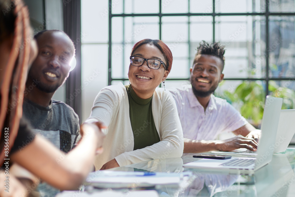 Fototapeta premium Diverse group of smiling businesspeople talking together around