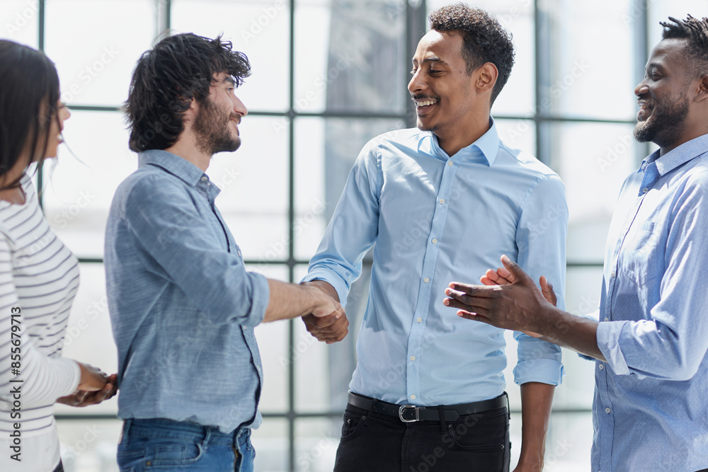Successful Business Collaboration: Executives Greet with Handshake in Office Successful Business Collaboration: Executives Greet with Handshake in Office