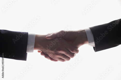 Two businessmen shake hands for agreement. Isolated image with white background, Business concept