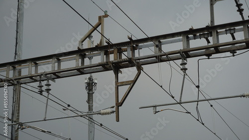 The condition of the transmission line of the electric rail train at a station in the afternoon 