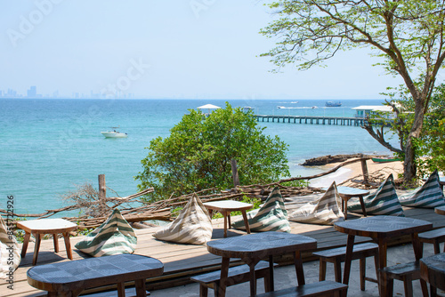 Seaside tables and chairs with views of the beautiful blue sea natural and clear sky. View of the sea and beach of Koh Larn, Pattaya, Thailand, 2024.