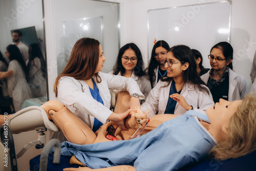 фотографія Gynaecology students learn on a woman's dummy