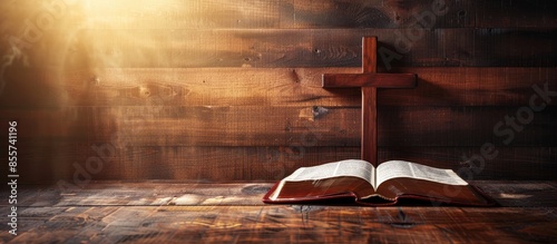 the wooden cross over opened bible on wooden table with window light, vintage tone. Copy space image. Place for adding text or design photo