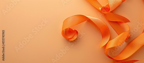 Orange ribbon on a pastel b...