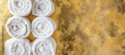 Rolled up white spa towels,...