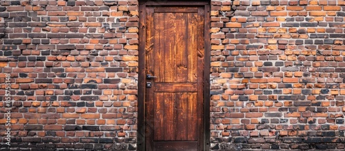 Wooden door on brick wall. ...