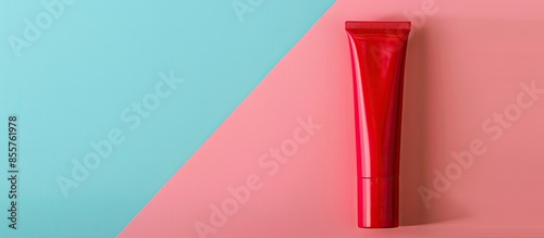 red cosmetic tube in pastel...