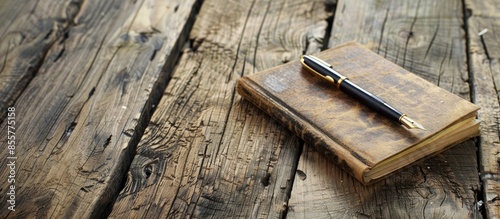 A notebook with a pen sitti...