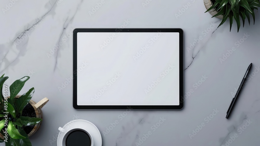 Top view of modern workplace with blank screen tablet computer, stationery and plant. Mock up Top view of modern workplace with blank screen tablet computer, stationery and plant. Mock up