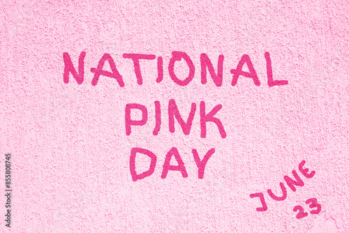 National pink day poster. Celebrate on June 23.  Holiday concept with handwriting on Pink concrete wall grunge background photo