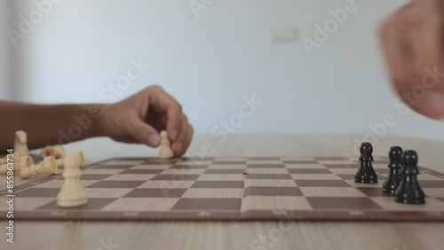 People playing chess at home and setting up the board with pieces for strategy planning and critical thinking on board game concept