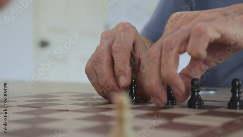 People playing chess at home and setting up the board with pieces for strategy planning and critical thinking on board game concept
