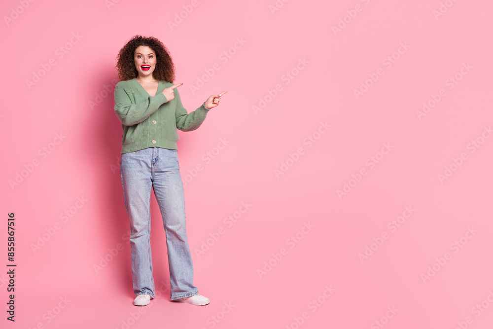 Photo of cheerful glad woman wear stylish khaki clothes demonstrate empty space banner isolated on pink color background Photo of cheerful glad woman wear stylish khaki clothes demonstrate empty space banner isolated on pink color background