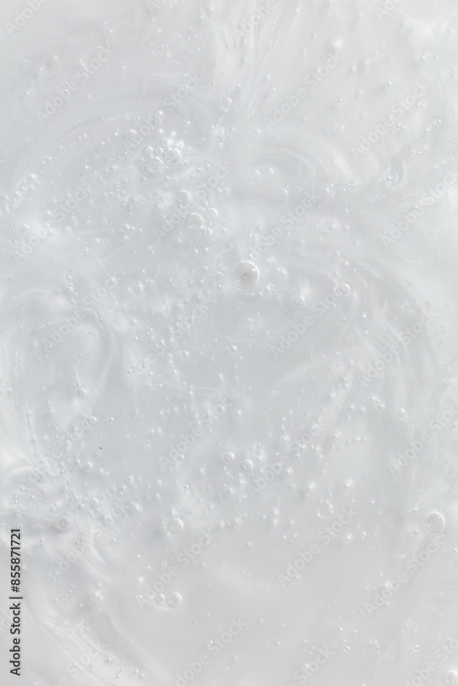 Macro shot of a moisturizer's texture showcasing its smooth, glossy surface with visible swirls and bubbles. This detailed close-up highlights the product's creamy and hydrating properties Macro shot of a moisturizer's texture showcasing its smooth, glossy surface with visible swirls and bubbles. This detailed close-up highlights the product's creamy and hydrating properties
