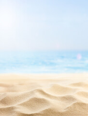 vertical summer background of beach sand and sea