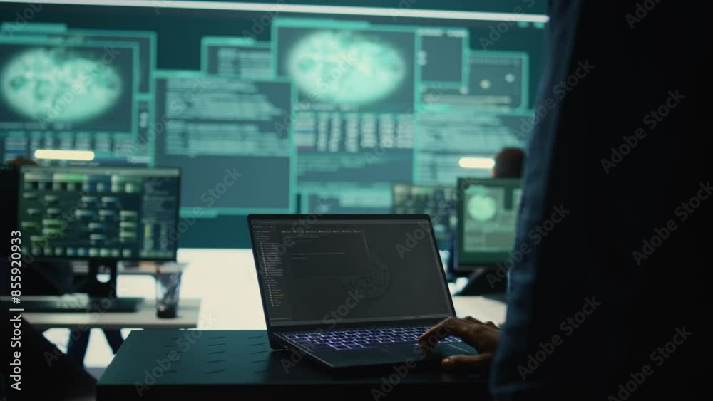 Governmental hackers at work monitoring cyber threats in high tech agency, implementing cybersecurity measures. IT expert focuses the importance of online privacy and malware protection. Camera B.