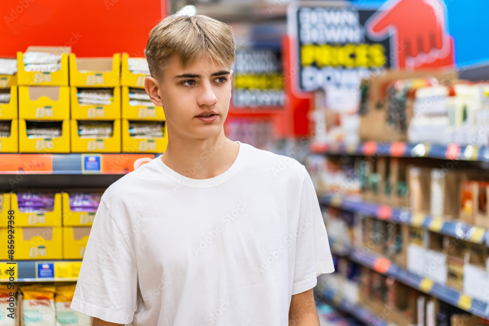 Supermarket shopper examines merchandise on shelves in Dubai. Supermarket shopper examines merchandise on shelves in Dubai.