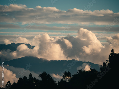 Beautiful misty mountain forest in sunset time