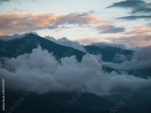 Beautiful misty mountain forest in sunset time