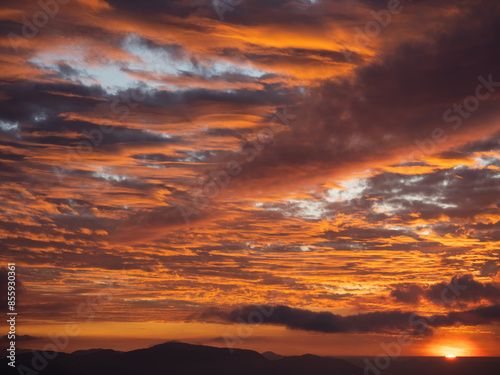 The sunset dyed clouds red.