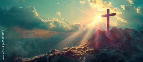 Christian cross on top of the hill with sunrays, crucifixion, religious concept. Copy space image. Place for adding text and design