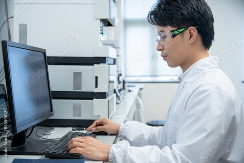 doctor working on computer in lab