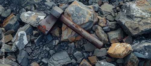 A Geological Hammer Laying on the rocks. Copy space image. Place for adding text or design