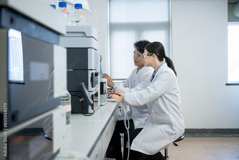 doctor working on computer in lab doctor working on computer in lab