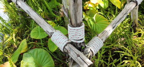 A white-red manila rope or Sisal Rope is wrap around attached a wooden pole to hold the wooden poles so they don't fall or to decorate the poles beautifully. The sisal plant fiber strong and durable.

