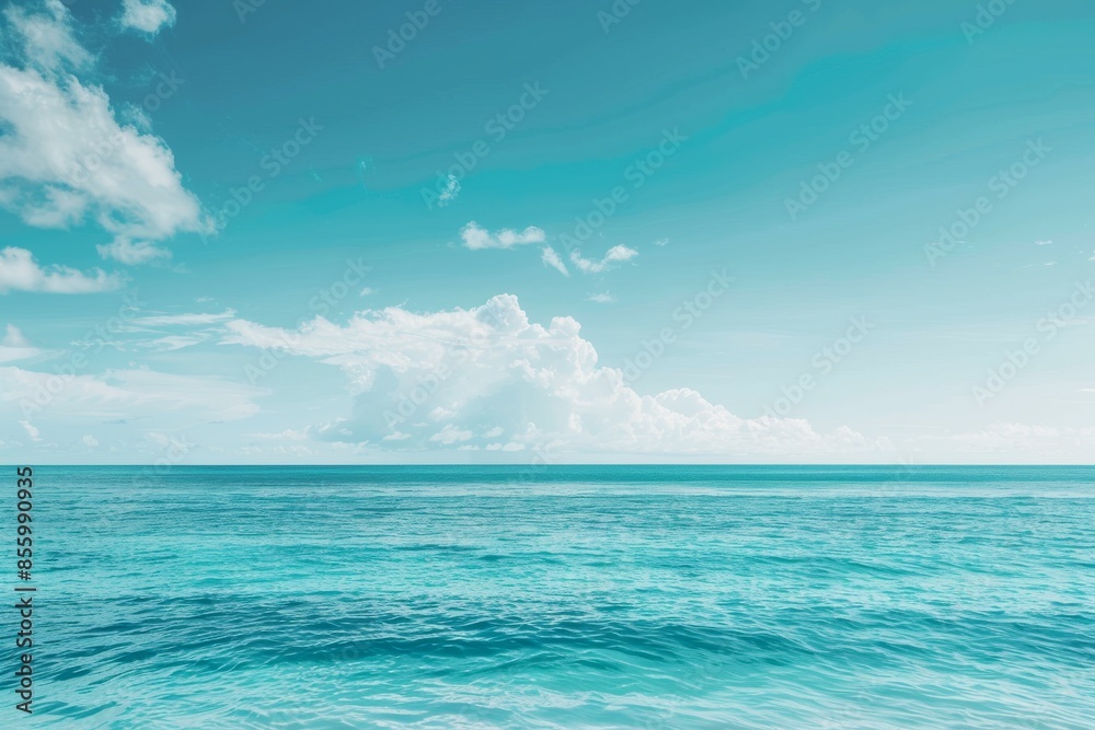 Obraz premium Soft clouds and blue sea in summer against a blurred sky