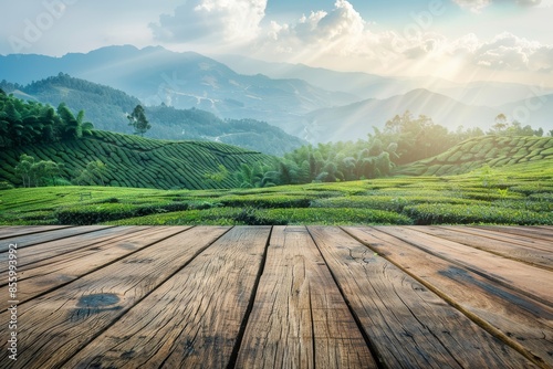 A tea plantation with an empty wooden terrace for product display design with a mountain panorama in the background