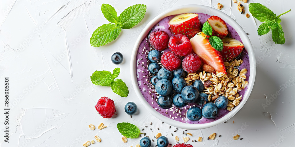 Flat lay of a corolful acai bowl topped with fruit Flat lay of a corolful acai bowl topped with fruit