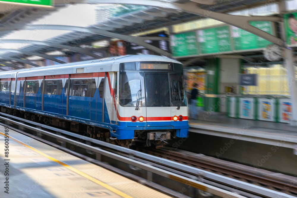 Fototapeta premium BKK BTS Bangkok Mass Transit System Sky train which is an elevated tram over the busy streets oh BKK Thailand 