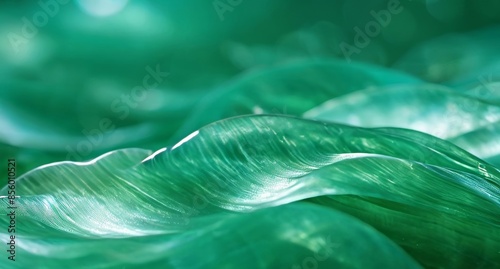 Close-up of vibrant green leaves with wavy texture and soft lighting highlighting intricate details, summer green juicy background