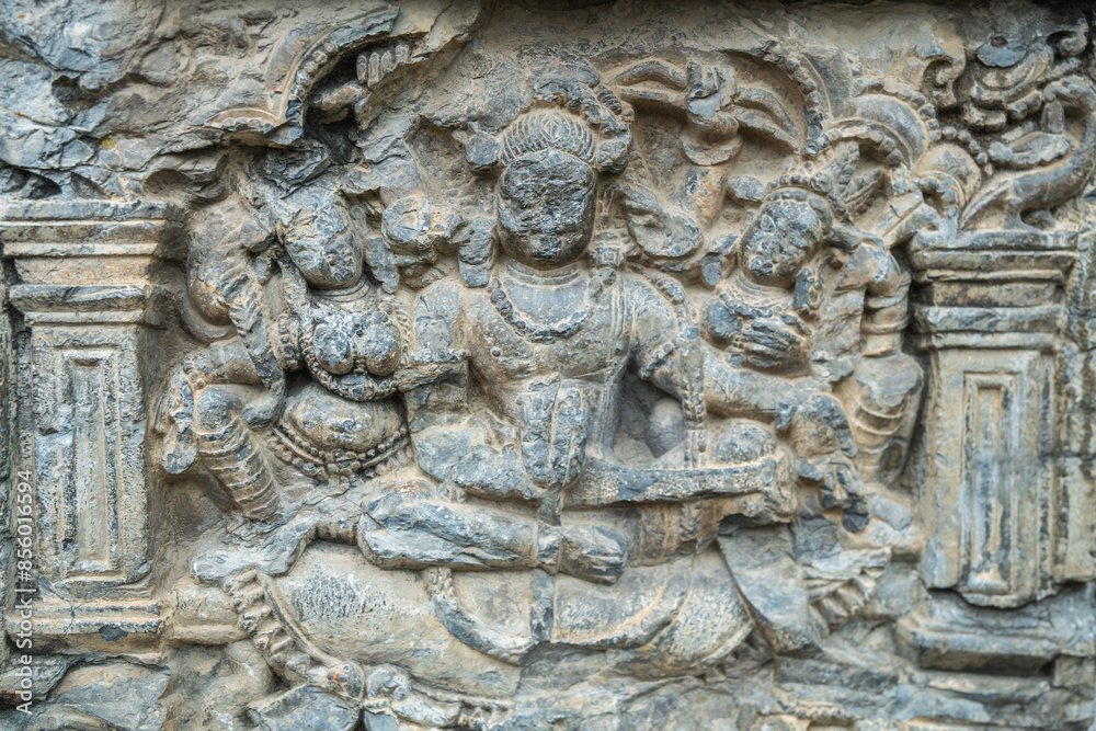 A stone carving depicting Indian god embedded on a wall, Srinagar, Kashmir, India A stone carving depicting Indian god embedded on a wall, Srinagar, Kashmir, India