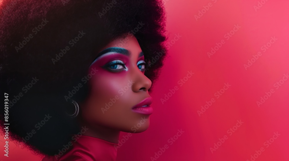 Striking striking portrait of a young Black woman with powerful makeup and afro hair, giving a fierce look Striking striking portrait of a young Black woman with powerful makeup and afro hair, giving a fierce look